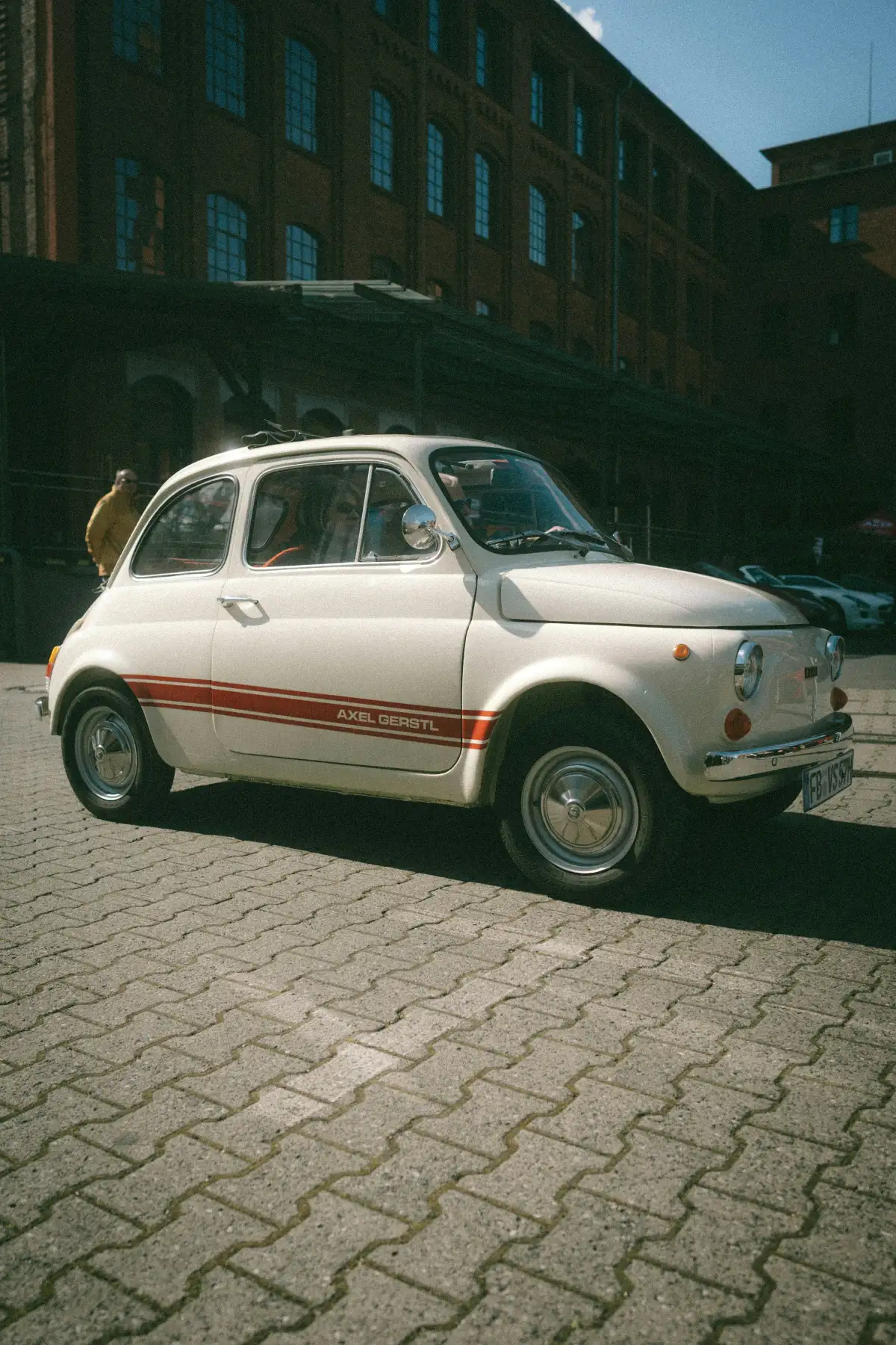 a car parked on a brick road